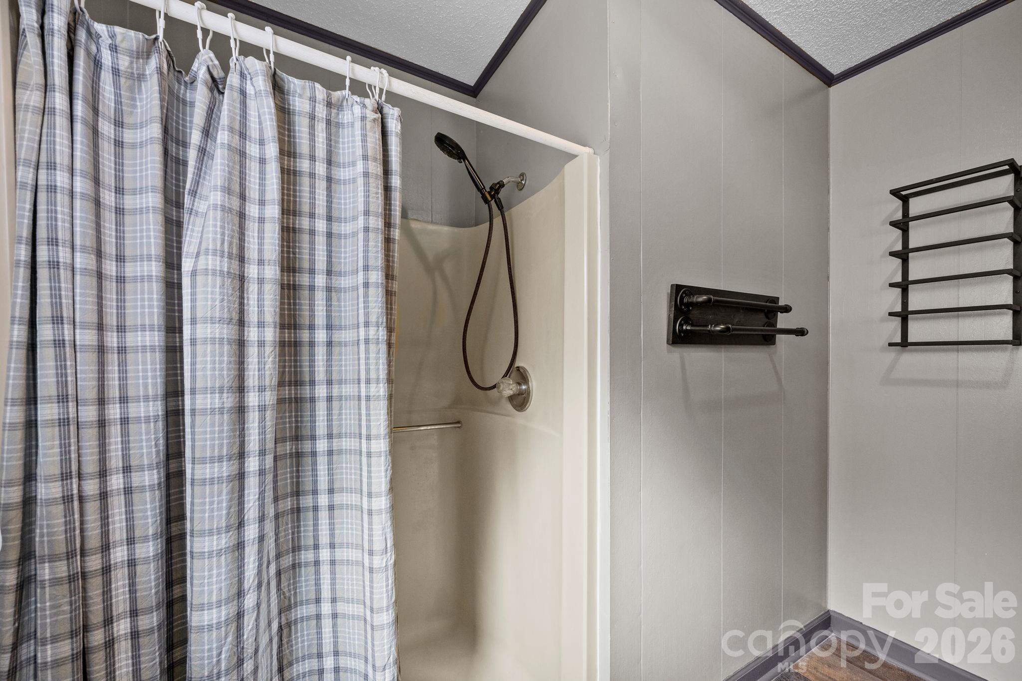 1169 Rickman Creek Road Franklin, NC 28734 - Photo 28 of 43 a bathroom with a shower