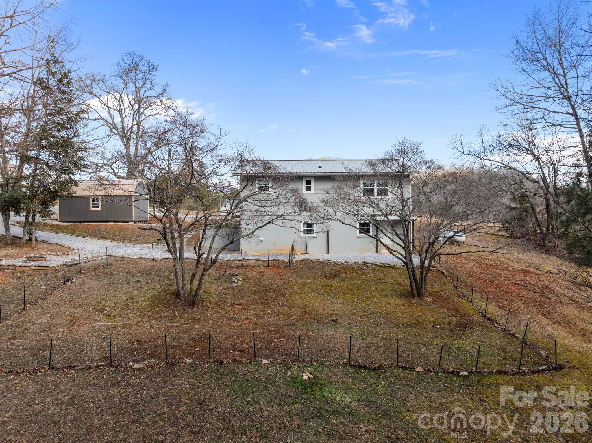 1169 Rickman Creek Road Franklin, NC 28734 - Photo 29 of 41 a view of a yard with a tree