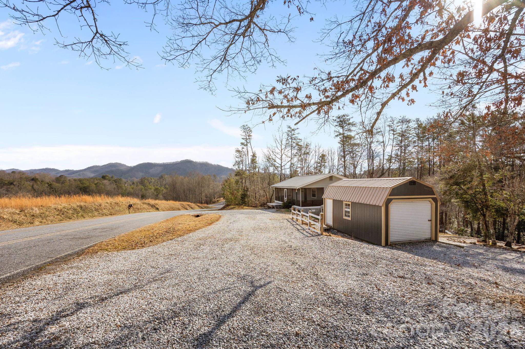 1169 Rickman Creek Road Franklin, NC 28734 - Photo 35 of 43 a view of a backyard of the house