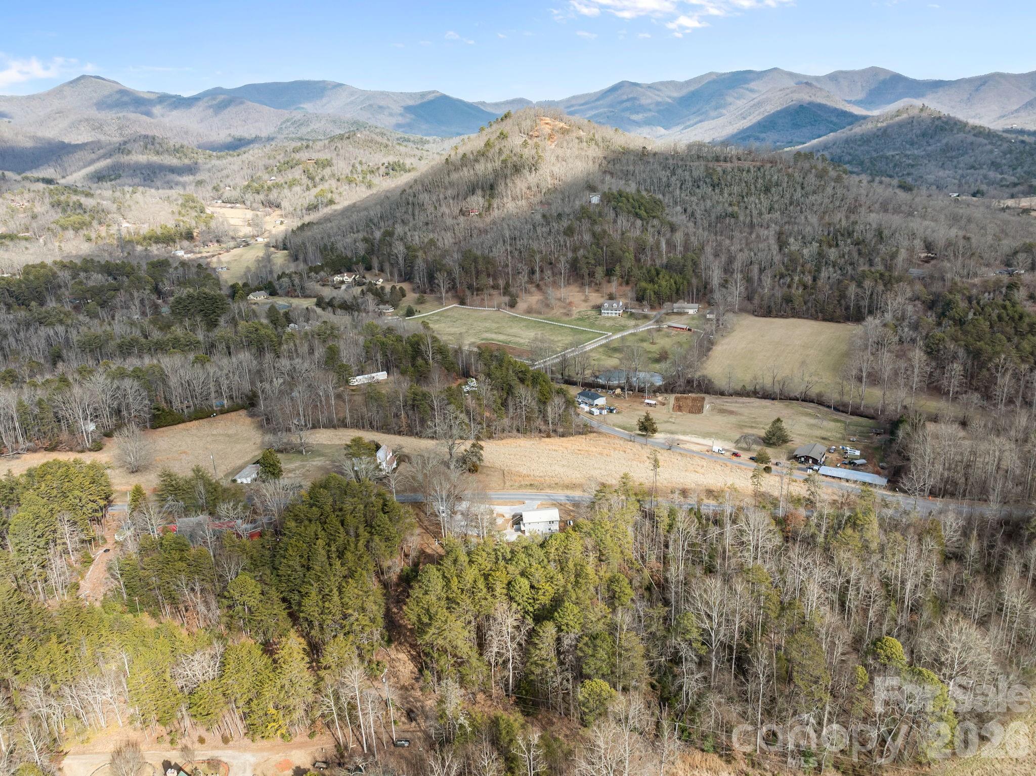 1169 Rickman Creek Road Franklin, NC 28734 - Photo 38 of 43 a view of a town with mountains in the background