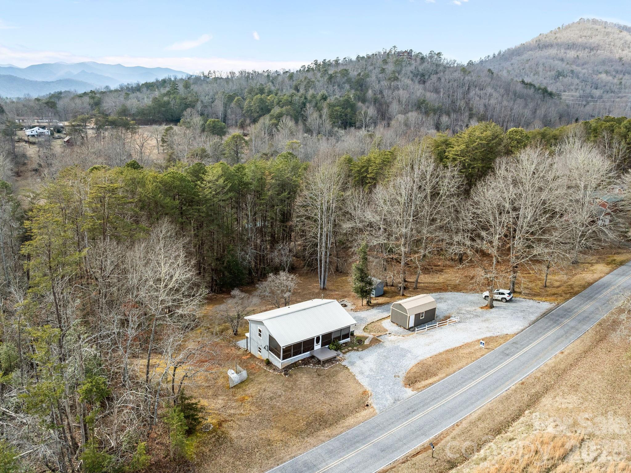 1169 Rickman Creek Road Franklin, NC 28734 - Photo 40 of 43 a view of a terrace with a yard