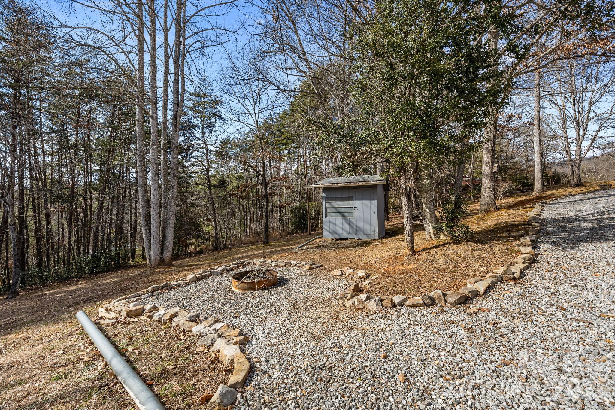 1169 Rickman Creek Road Franklin, NC 28734 - Photo 42 of 43 a front view of a house with a yard