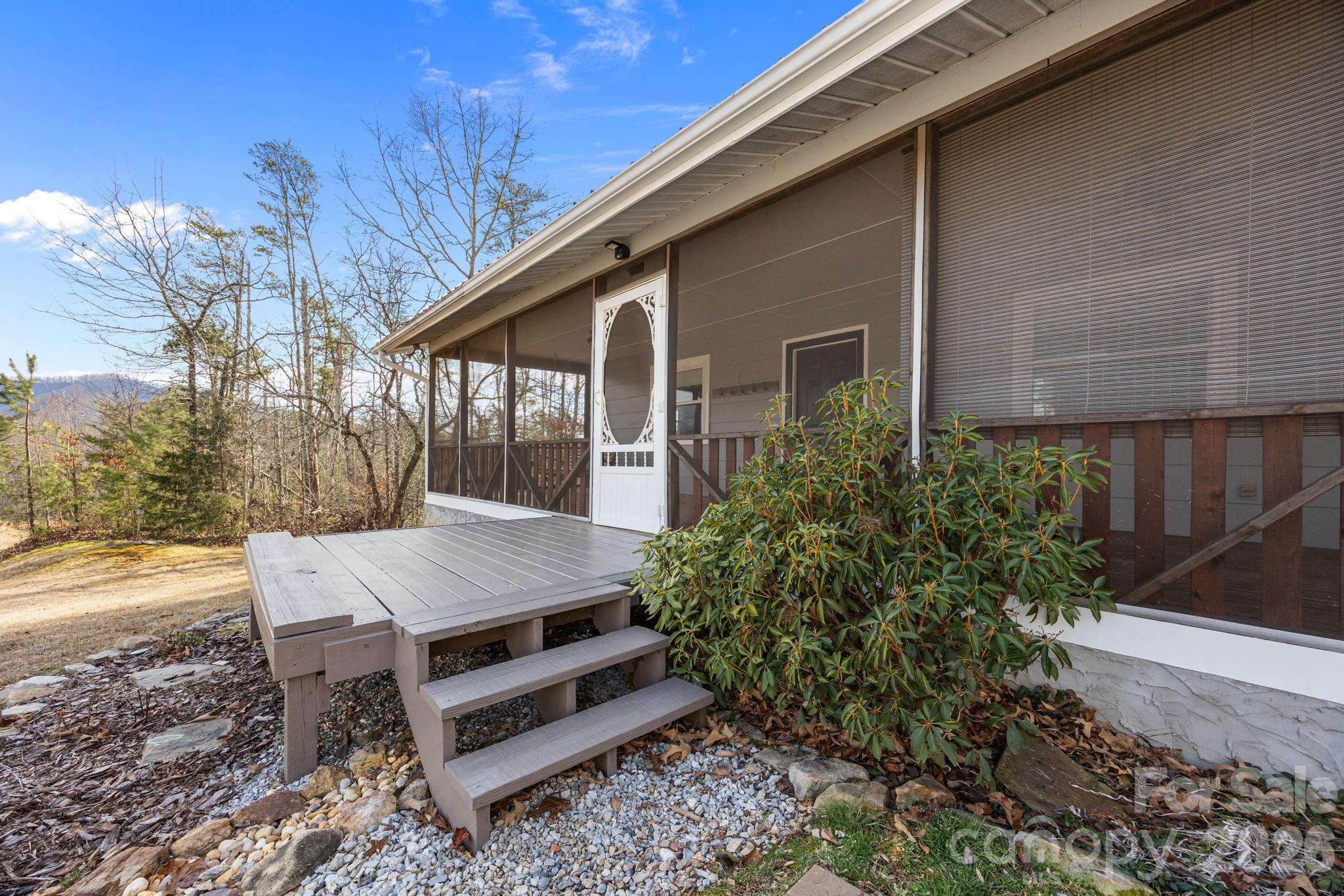 1169 Rickman Creek Road Franklin, NC 28734 - Photo 6 of 43 a view of a backyard with sitting area