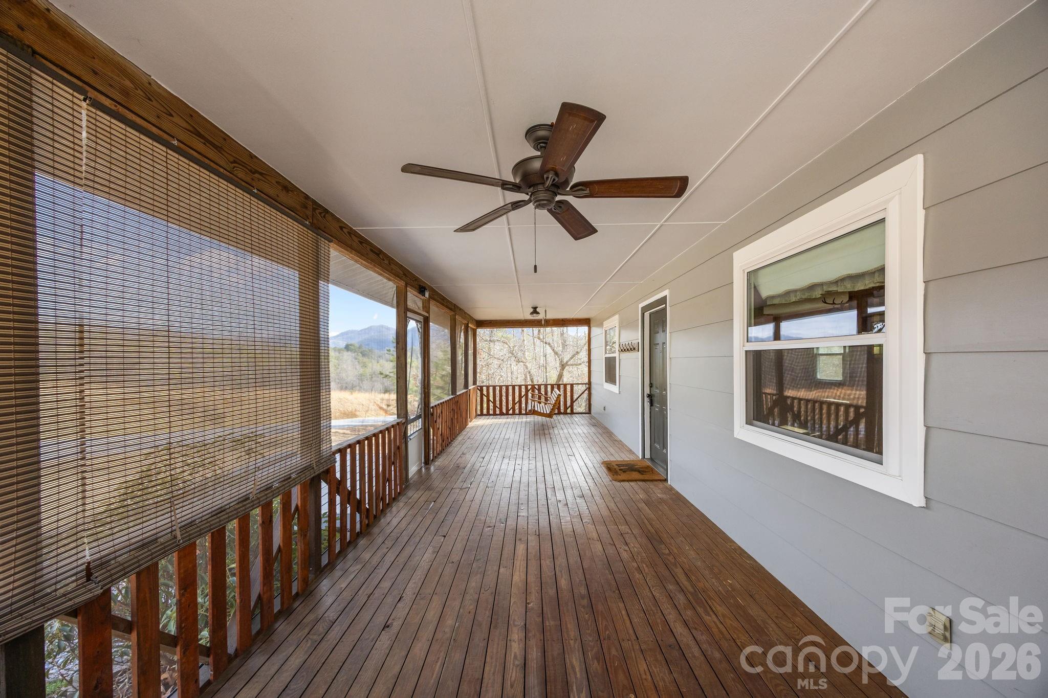 1169 Rickman Creek Road Franklin, NC 28734 - Photo 9 of 43 a view of a house with wooden floor
