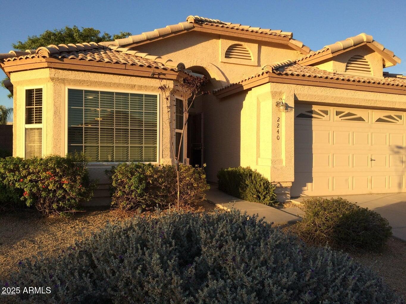 2240 East Aire Libre Avenue Phoenix, AZ 85022 - Photo 18 of 18 a front view of a house with a yard