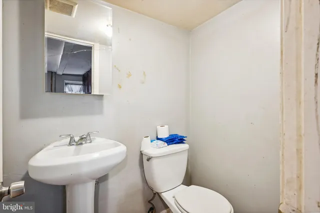 a view of a storage and utility room with washer and dryer