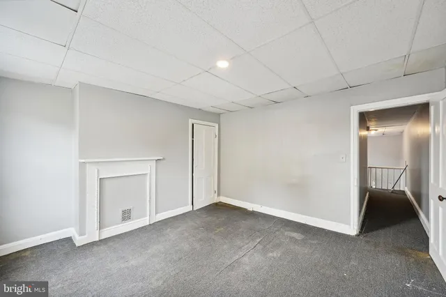 a view of a hallway with a white walls