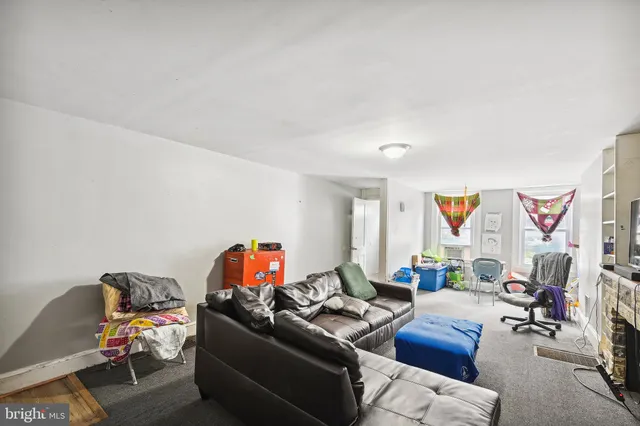 a kitchen with stainless steel appliances granite countertop a stove refrigerator and cabinets