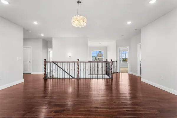 a view of an entryway with wooden floor