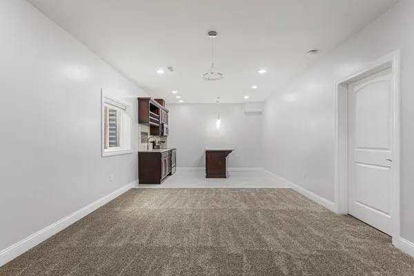 a kitchen with stainless steel appliances granite countertop a stove and a sink
