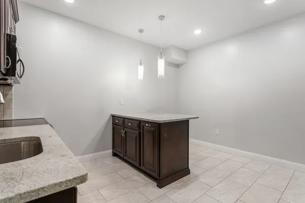 a kitchen with a stove and a sink