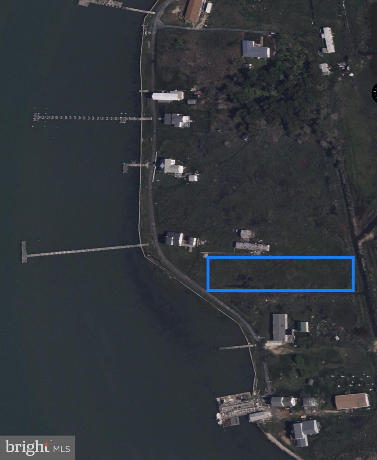 7 Tylerton Road Tylerton, MD 21866 - Photo 4 of 16 a picture of water heater room with wooden floor