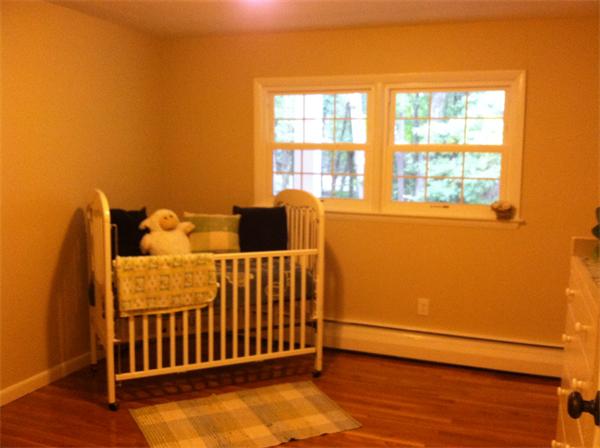 10 Colonial Road Sutton, MA 01590 - Photo 13 of 13 a bedroom with a bed and wooden floor