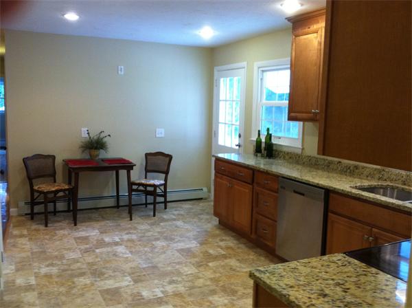 10 Colonial Road Sutton, MA 01590 - Photo 3 of 13 a living room with furniture and a table