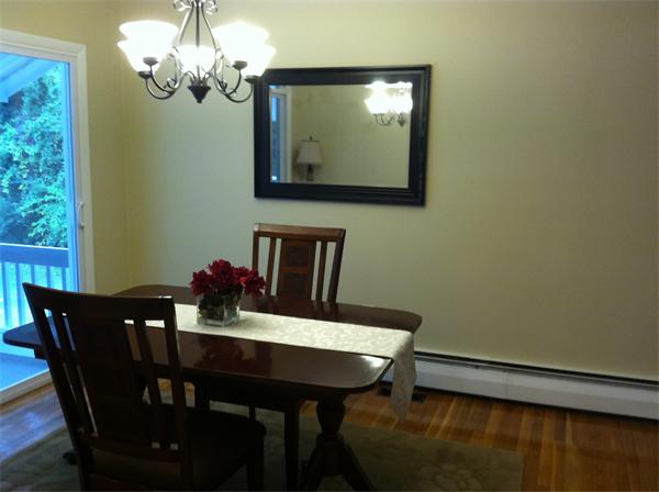 10 Colonial Road Sutton, MA 01590 - Photo 4 of 13 a view of a dining room with furniture and wooden floor