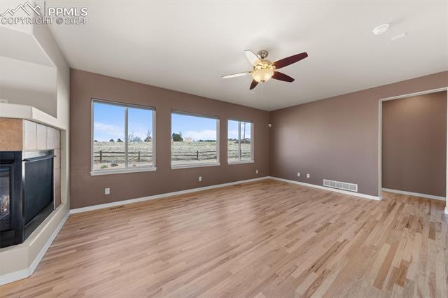 766 Struthers Ranch Road Colorado Springs, CO 80921 - Photo 9 of 40 The large family room has a wall of windows, filling the room with light!