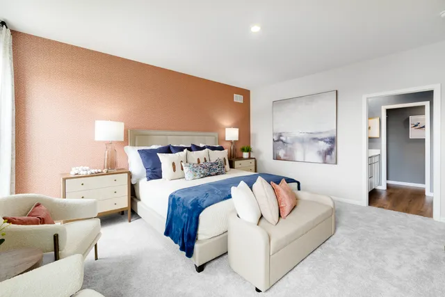 a bedroom with a bed and couch