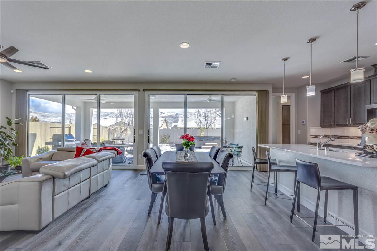 9830 Shadowless Trail Reno, NV 89521 - Photo 8 of 24 a view of a dining room with furniture window and wooden floor