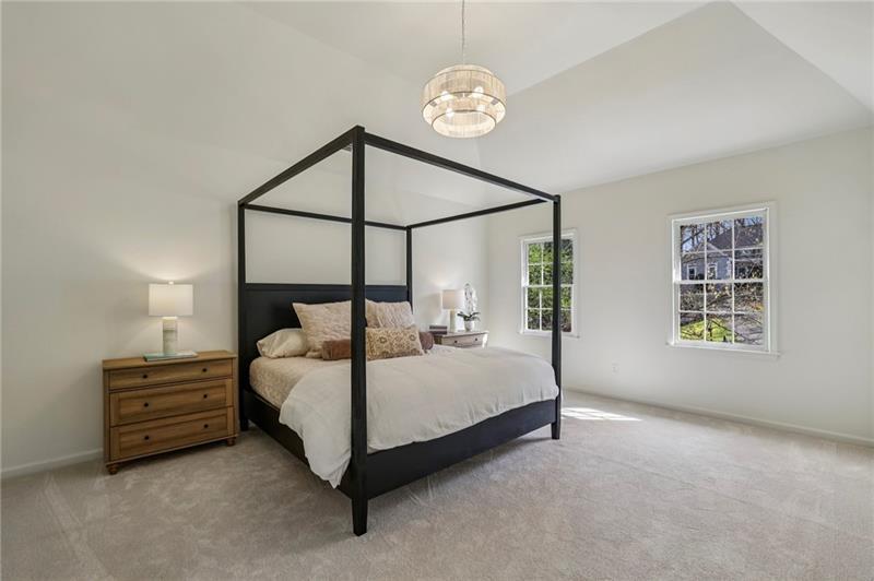 105 Inverness Approach Roswell, GA 30075 - Photo 24 of 51 a bed room with a bed and a chandelier