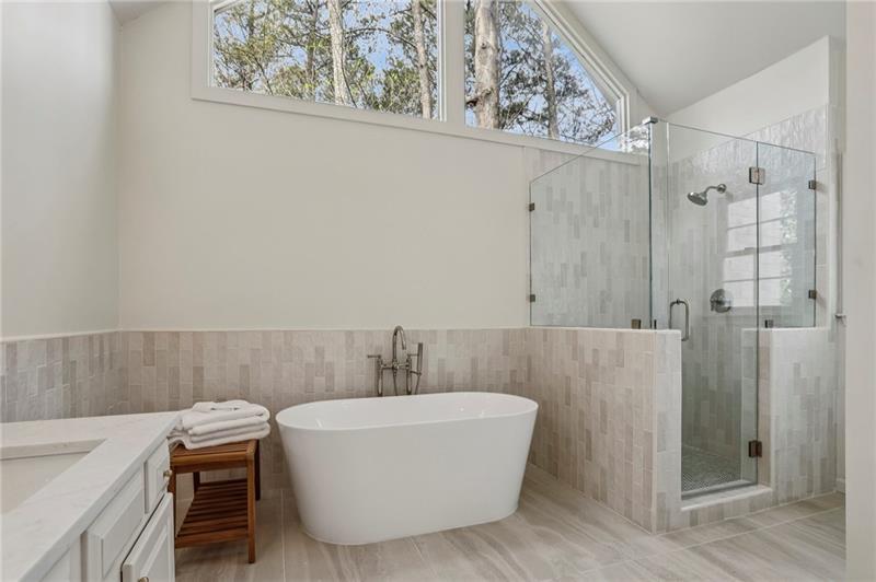 105 Inverness Approach Roswell, GA 30075 - Photo 26 of 51 a bathroom with a bathtub and shower