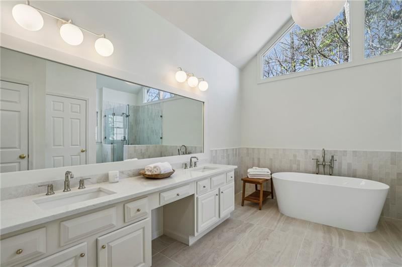 105 Inverness Approach Roswell, GA 30075 - Photo 27 of 51 a bathroom with a double vanity sink a mirror and a bathtub