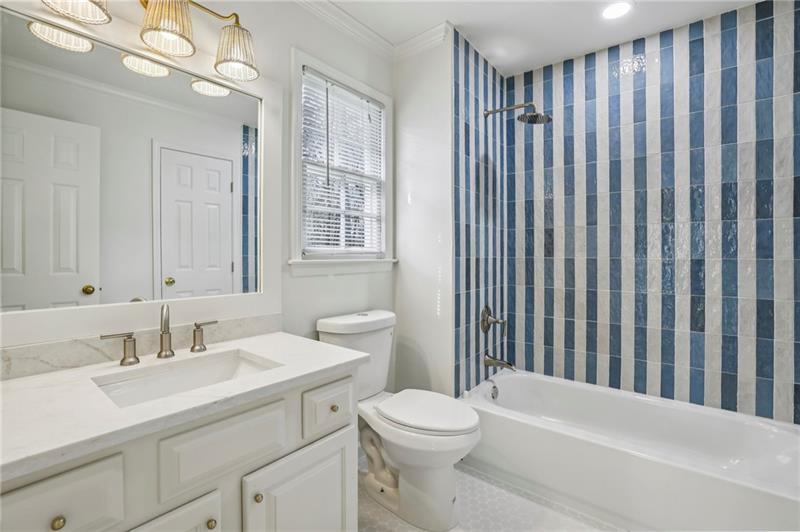 105 Inverness Approach Roswell, GA 30075 - Photo 31 of 51 a bathroom with a sink a toilet and shower