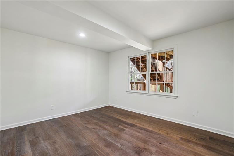 105 Inverness Approach Roswell, GA 30075 - Photo 35 of 51 an empty room with wooden floor and windows