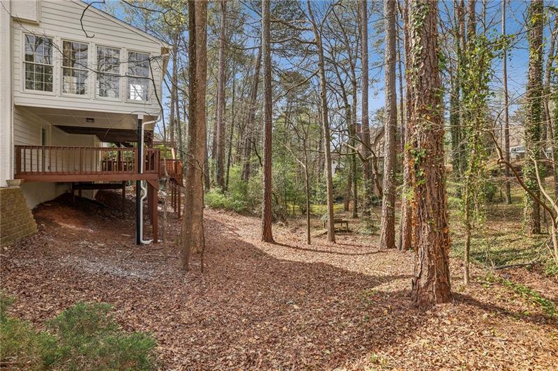 105 Inverness Approach Roswell, GA 30075 - Photo 41 of 51 a backyard of a house with barbeque oven