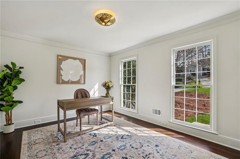 105 Inverness Approach Roswell, GA 30075 - Photo 9 of 51 a view of a workspace with furniture and a window