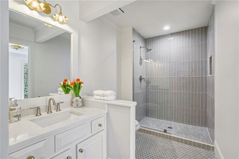 105 Inverness Approach Roswell, GA 30075 - Photo 10 of 51 a bathroom with a granite countertop sink a shower and a mirror