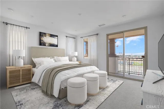 a spacious bedroom with a bed and a large window