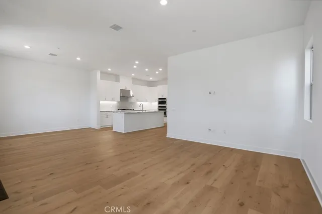 a view of kitchen with wooden floor