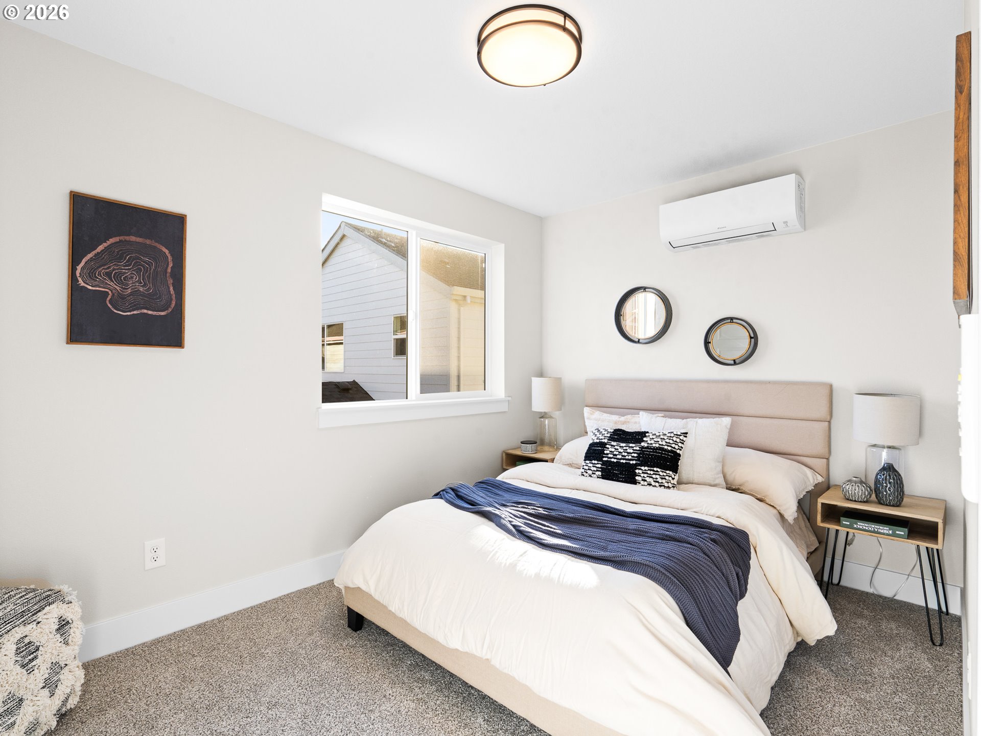7460 North Polk Avenue Portland, OR 97203 - Photo 11 of 25 a bedroom with a bed and a window