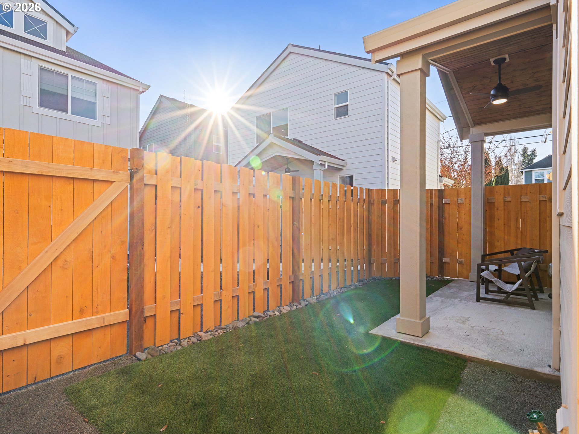 7460 North Polk Avenue Portland, OR 97203 - Photo 15 of 25 a bedroom with a bed and a chandelier