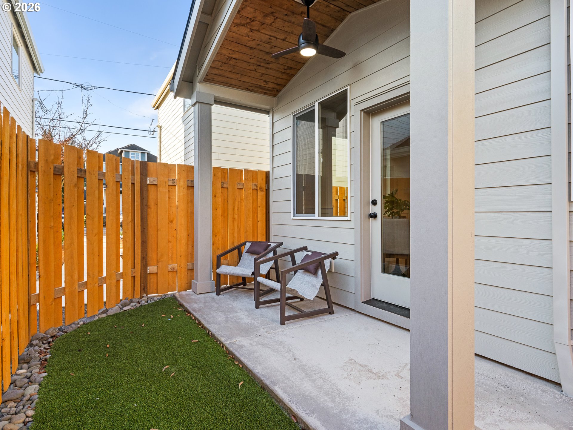 7460 North Polk Avenue Portland, OR 97203 - Photo 16 of 25 a backyard of a house with outdoor seating