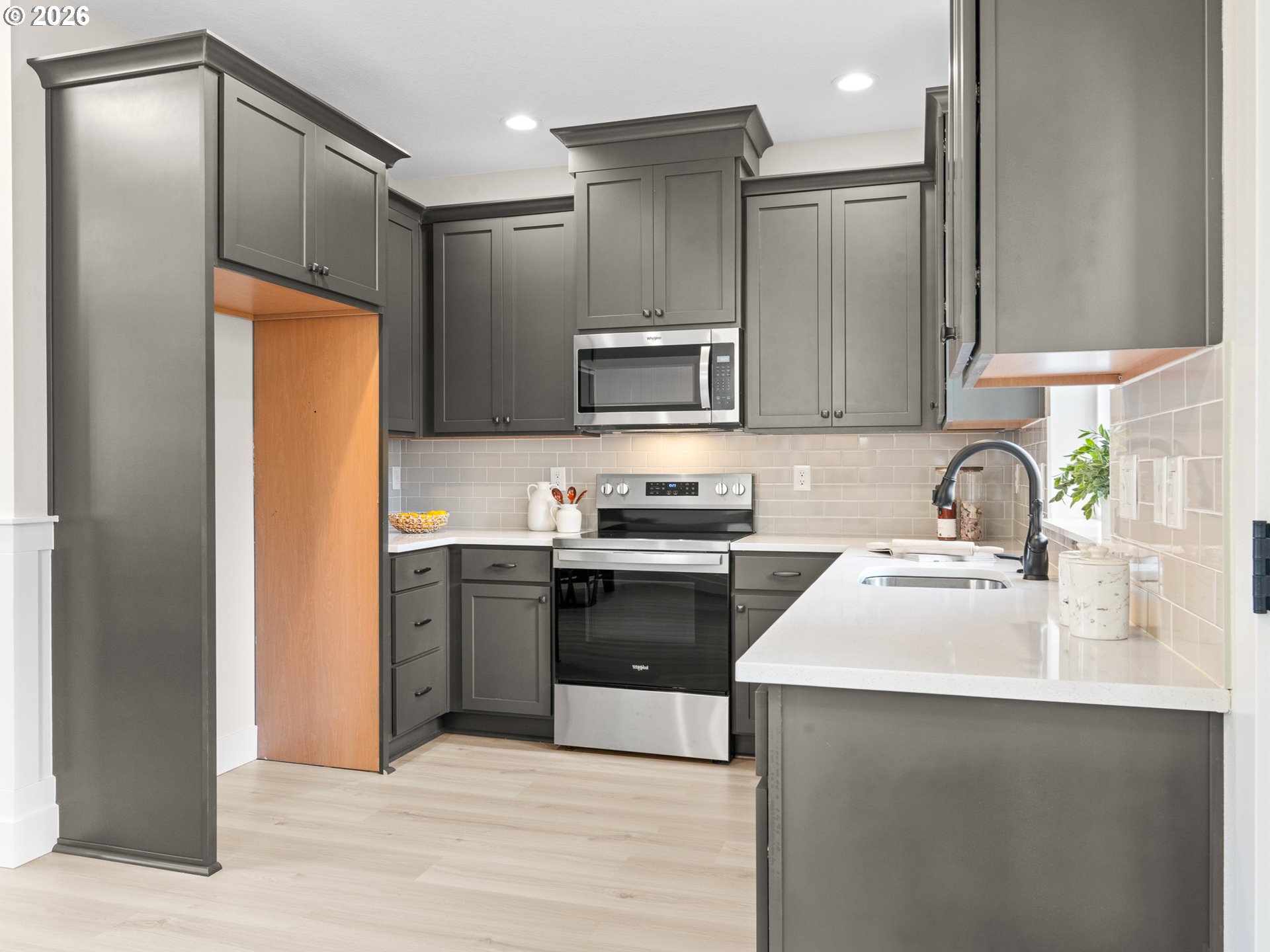 7460 North Polk Avenue Portland, OR 97203 - Photo 7 of 25 a kitchen with a refrigerator sink and stove