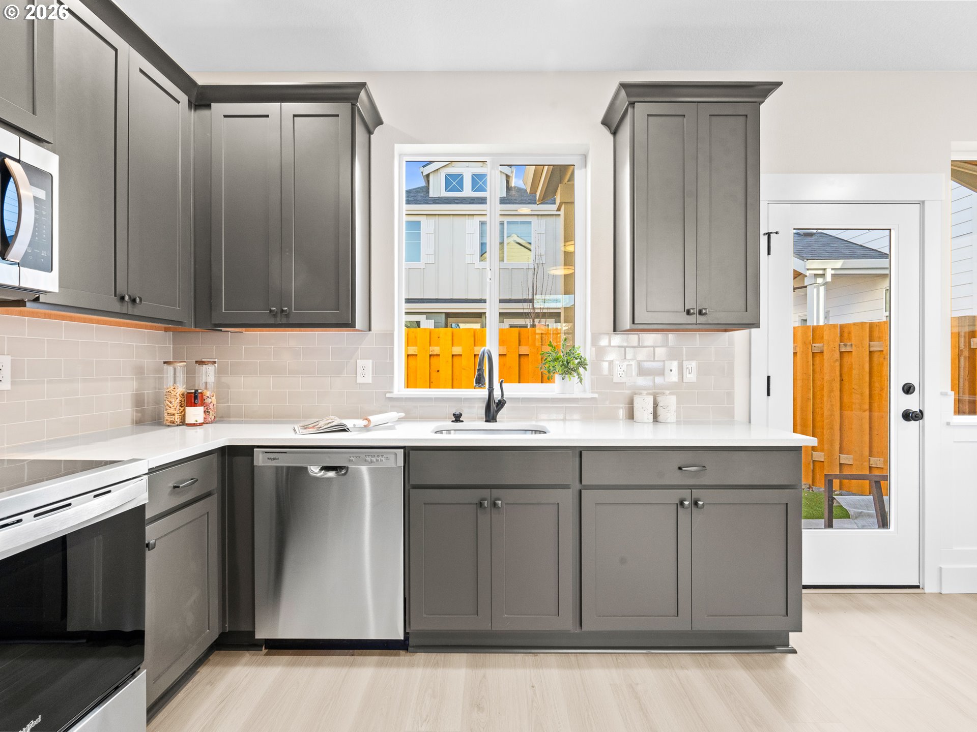 7460 North Polk Avenue Portland, OR 97203 - Photo 9 of 25 a kitchen with a sink a stove and cabinets