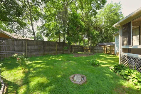 a view of a backyard with a tree