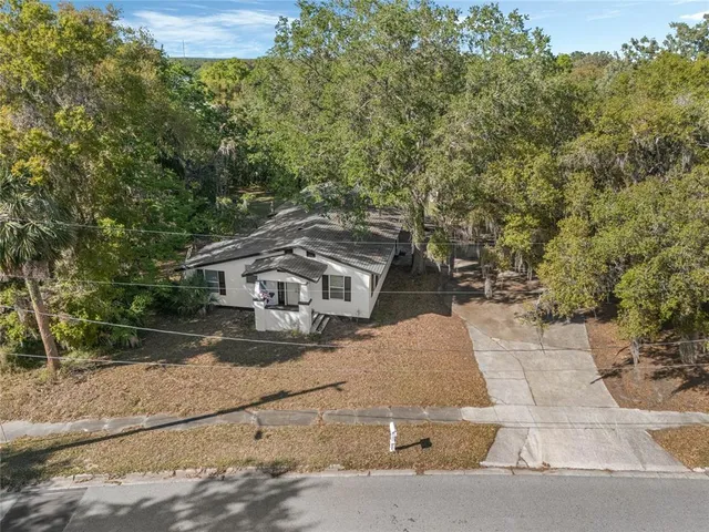 an aerial view of residential house with outdoor space