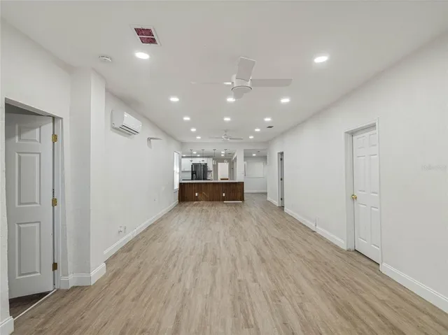 a view of a livingroom with wooden floor
