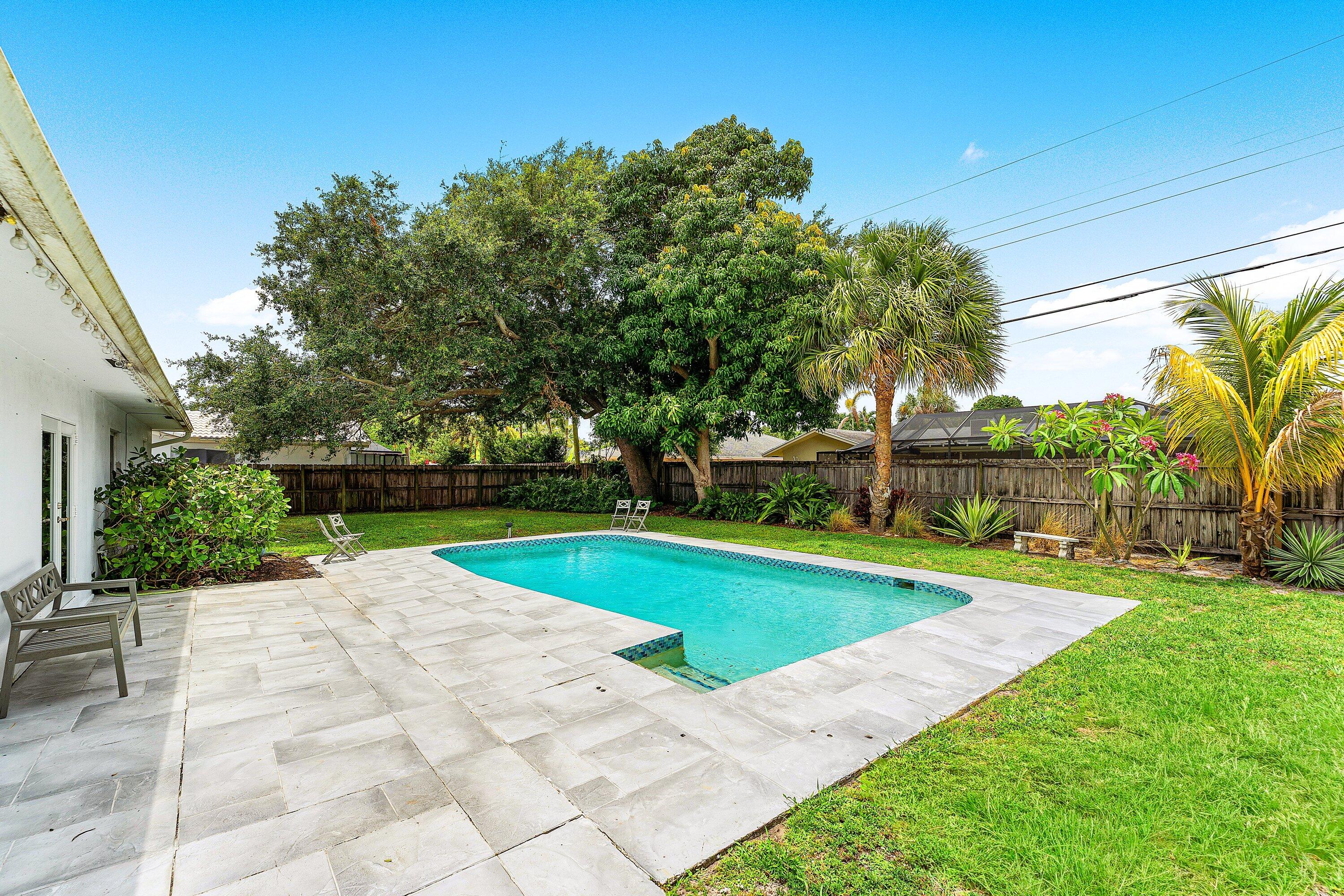 581 Northwest 13th Drive Boca Raton, FL 33486 - Photo 35 of 39 a view of a backyard with a garden