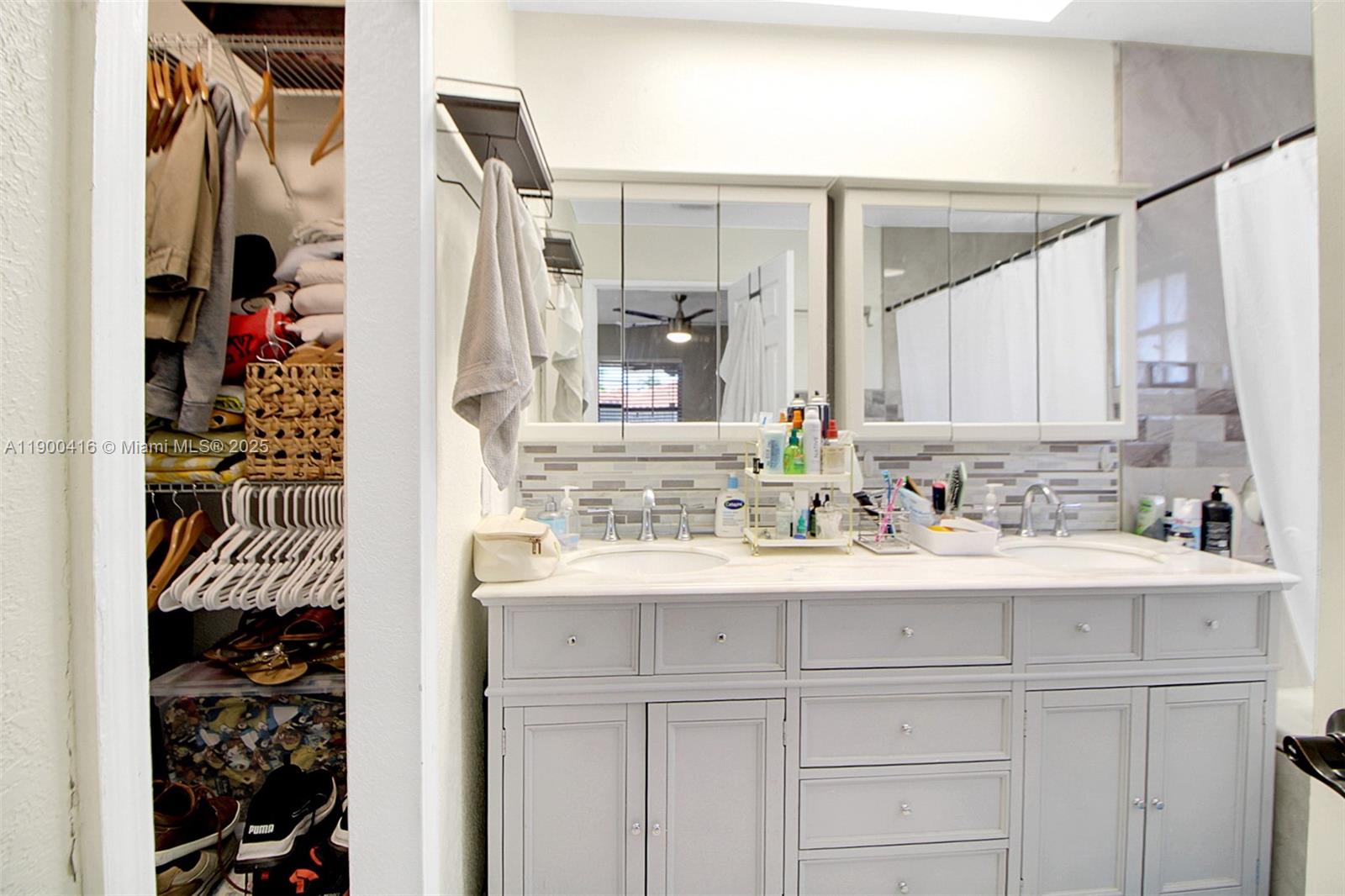14880 Southwest 56th Terrace Miami, FL 33193 - Photo 25 of 35 a bathroom with a sink and a mirror