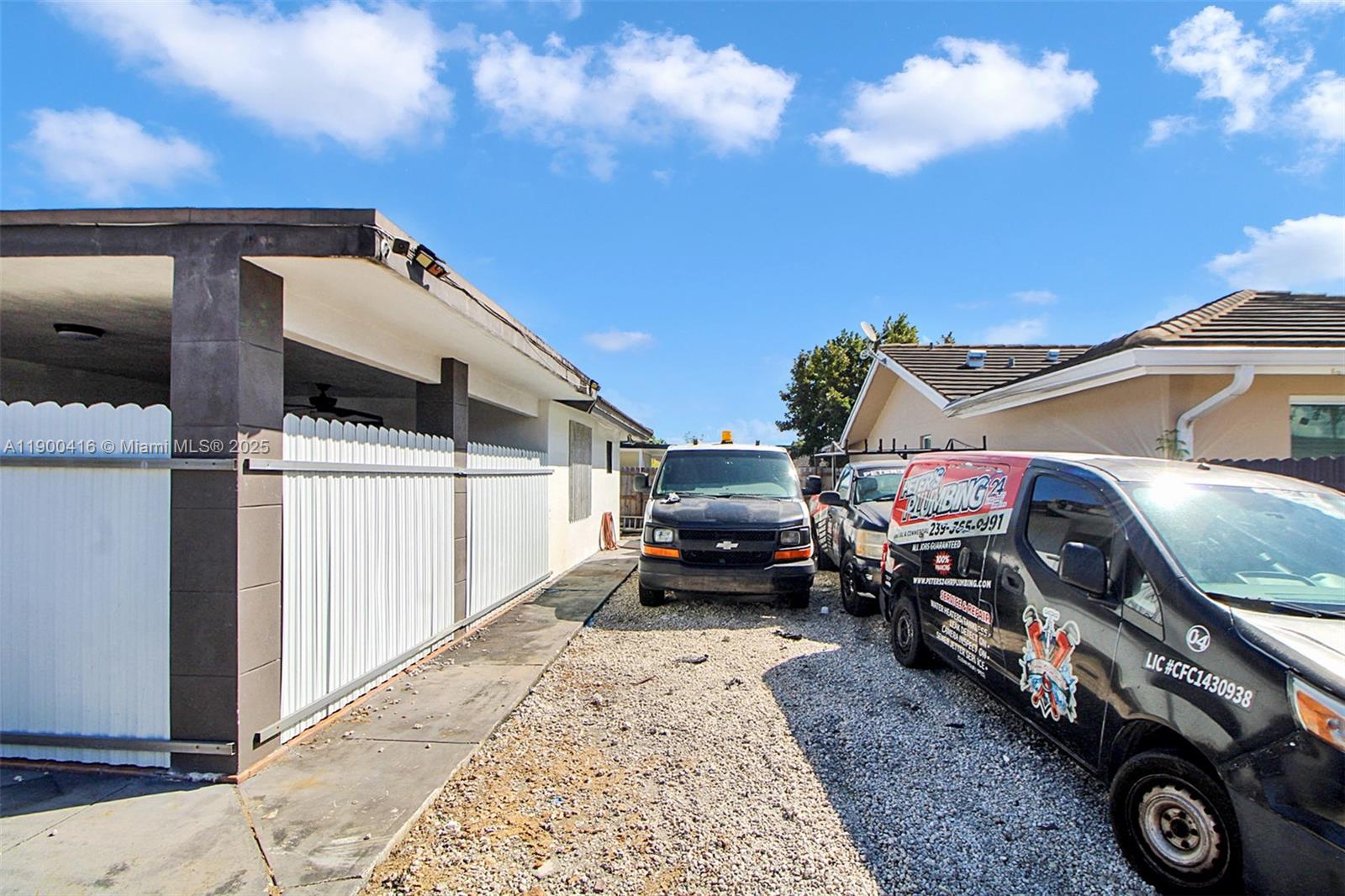 14880 Southwest 56th Terrace Miami, FL 33193 - Photo 5 of 35 a view of a car park in front of house