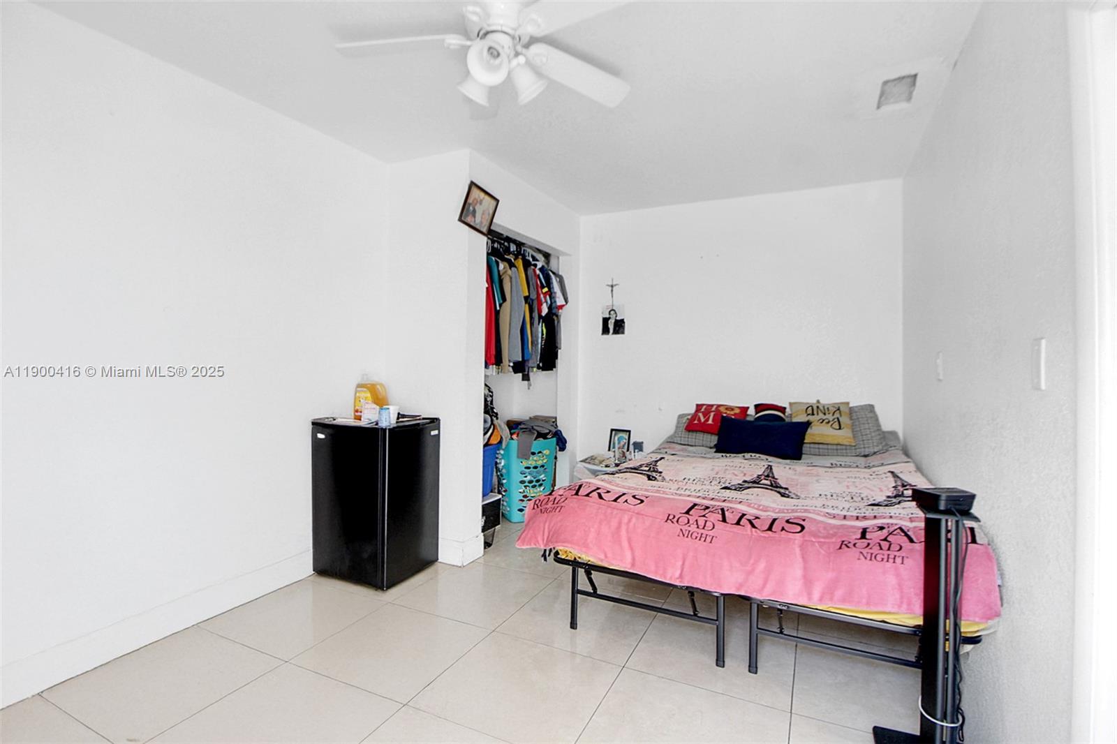 14880 Southwest 56th Terrace Miami, FL 33193 - Photo 7 of 35 a bedroom with a bed and a chandelier