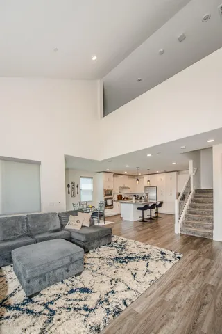 a spacious bedroom with a bed and a flat screen tv