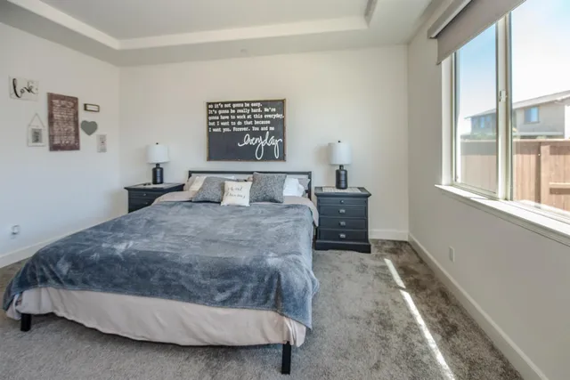 a bathroom with a granite countertop sink a mirror and a shower