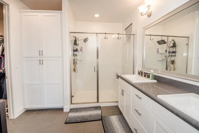 a spacious bathroom with a granite countertop sink mirror and toilet