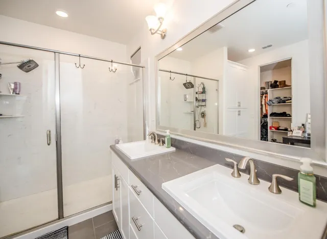 a bathroom with a sink a toilet and shower curtain