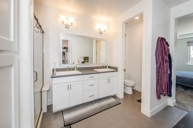 a bedroom with bed and a closet