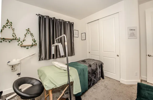 a view of a hallway with seating area